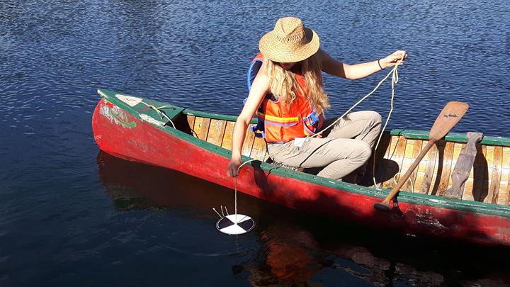 Volunteer Emily Corbett participates in the Lake Partner Program on her lake