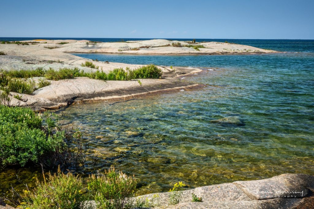 A photo of the water and rocks of Georgian Bay. Photo credit: Thom Morrissey